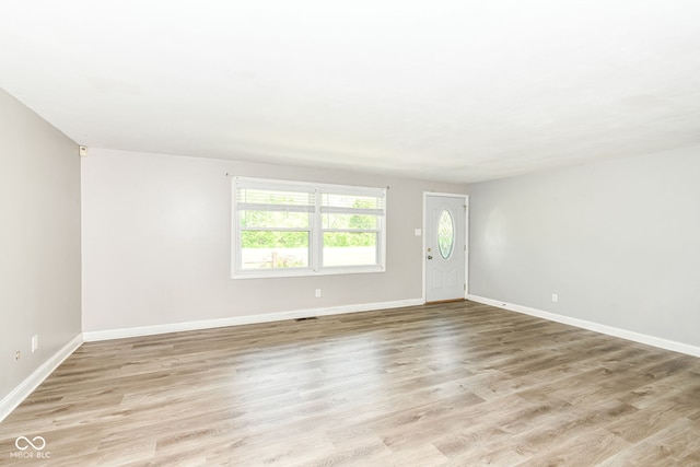 1543 W 79th St, Indianapolis, IN 46260 - spare room featuring baseboards and light wood-style floors