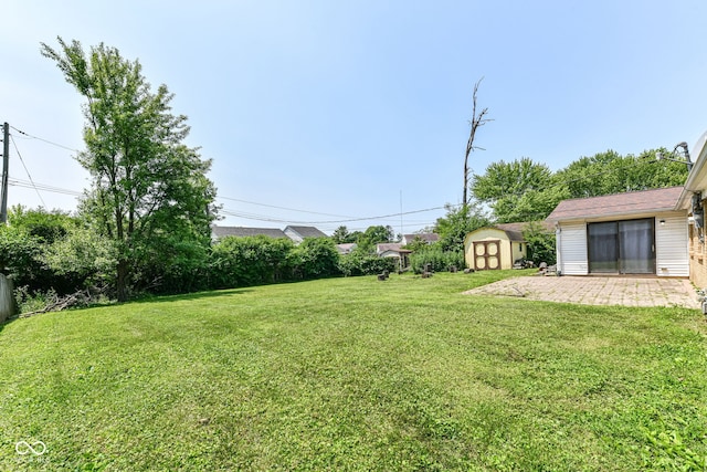 1543 W 79th St, Indianapolis, IN 46260 - view of green lawn featuring a shed and a patio area