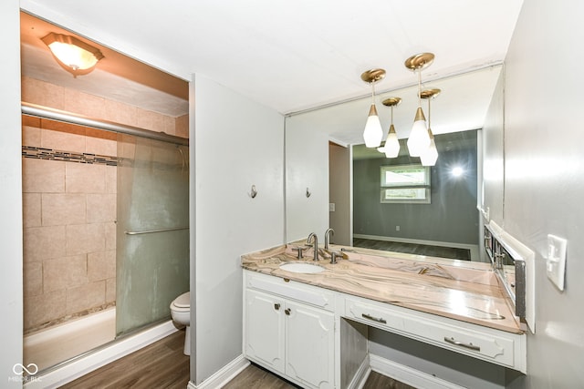 1543 W 79th St, Indianapolis, IN 46260 - full bathroom featuring vanity, a shower stall, and wood finished floors