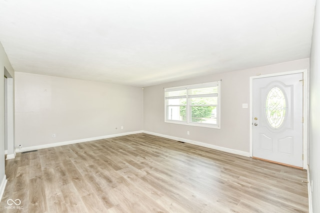 1543 W 79th St, Indianapolis, IN 46260 - foyer entrance with baseboards and light wood-style flooring
