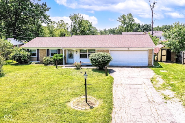 1543 W 79th St, Indianapolis, IN 46260 - ranch-style house with a shed, driveway, brick siding, an attached garage, and roof with shingles