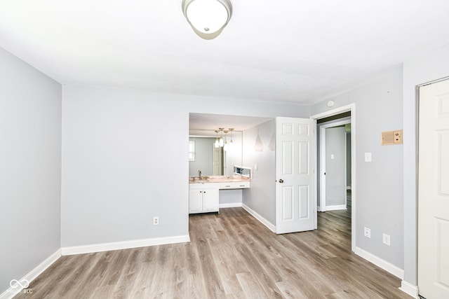 1543 W 79th St, Indianapolis, IN 46260 - unfurnished bedroom featuring light wood-style floors and ensuite bath