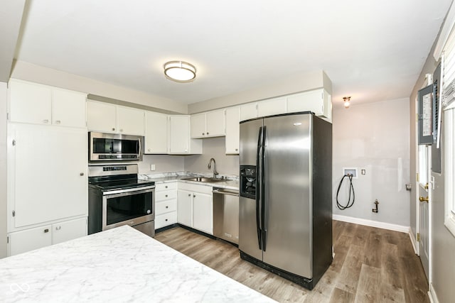 1543 W 79th St, Indianapolis, IN 46260 - kitchen featuring appliances with stainless steel finishes, dark wood-style floors, and white cabinetry
