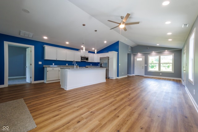 5122 W Legrande Ave, Indianapolis, IN 46241 - kitchen featuring stainless steel appliances, open floor plan, vaulted ceiling, white cabinetry, and ceiling fan