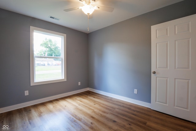 5122 W Legrande Ave, Indianapolis, IN 46241 - empty room with wood finished floors and a ceiling fan