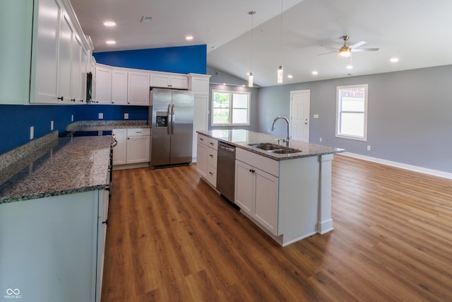 5122 W Legrande Ave, Indianapolis, IN 46241 - kitchen with appliances with stainless steel finishes, wood finished floors, lofted ceiling, white cabinets, and a center island with sink