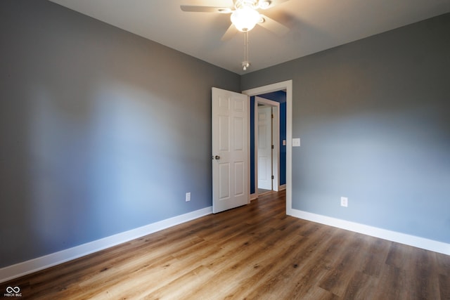5122 W Legrande Ave, Indianapolis, IN 46241 - spare room with a ceiling fan and wood finished floors