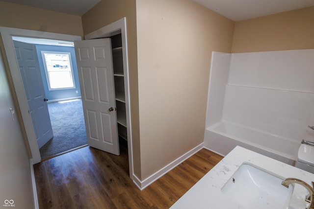 5122 W Legrande Ave, Indianapolis, IN 46241 - bathroom with wood finished floors, vanity, and a bath