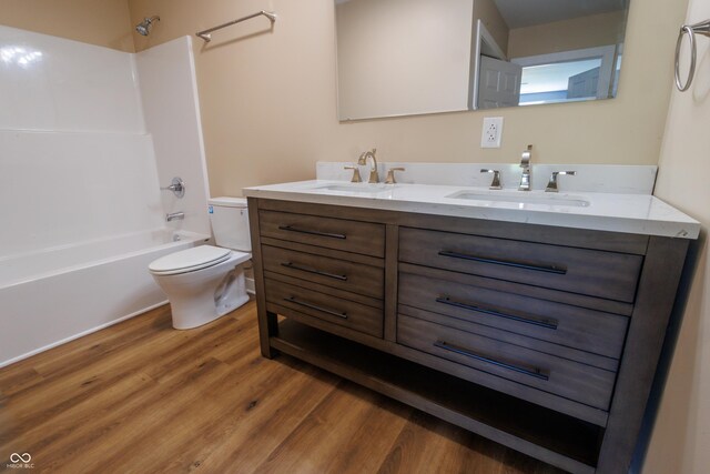 5122 W Legrande Ave, Indianapolis, IN 46241 - full bathroom with wood finished floors, double vanity, and shower / bathtub combination