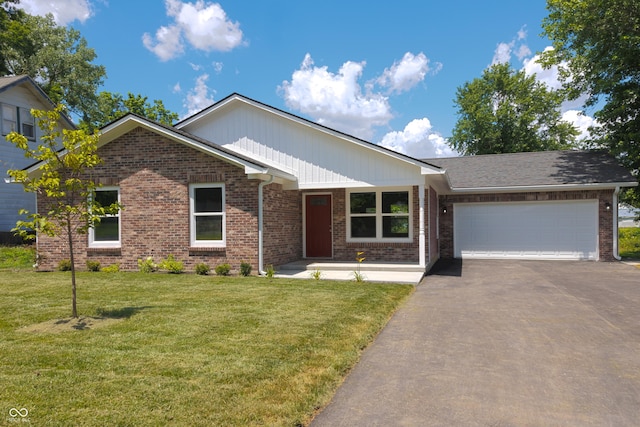 5122 W Legrande Ave, Indianapolis, IN 46241 - ranch-style home featuring driveway, brick siding, an attached garage, and a front lawn