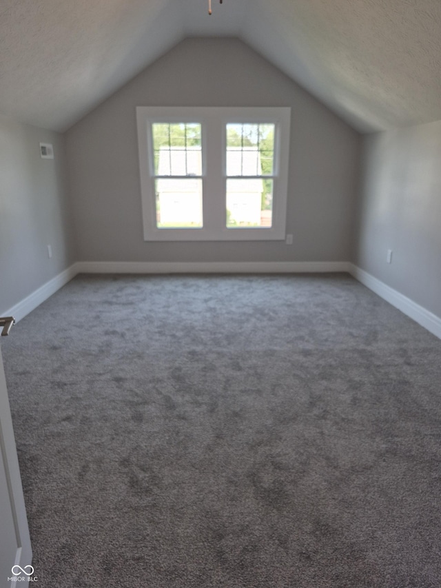 1501 California St, Columbus, IN 47201 - additional living space with vaulted ceiling and carpet flooring