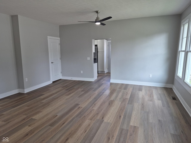 1501 California St, Columbus, IN 47201 - spare room featuring dark wood finished floors and ceiling fan