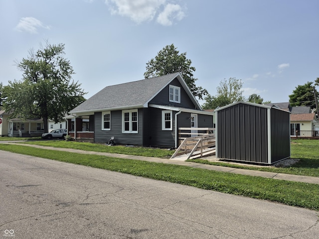 1501 California St, Columbus, IN 47201 - view of front of house with a storage unit and roof with shingles