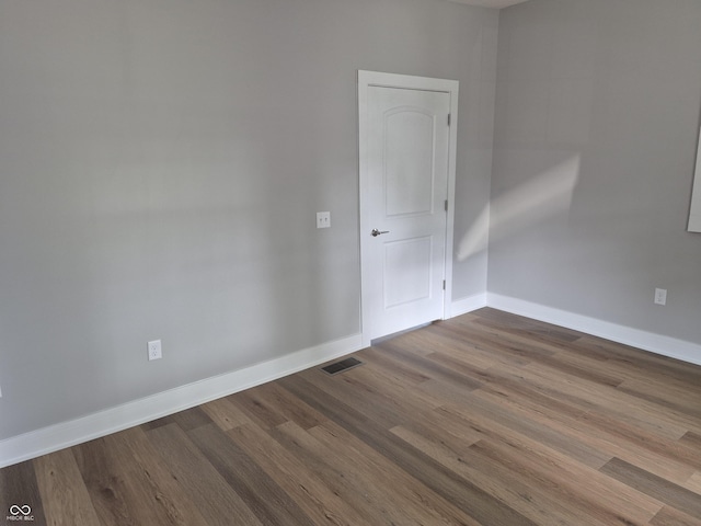 1501 California St, Columbus, IN 47201 - empty room featuring dark wood-style flooring