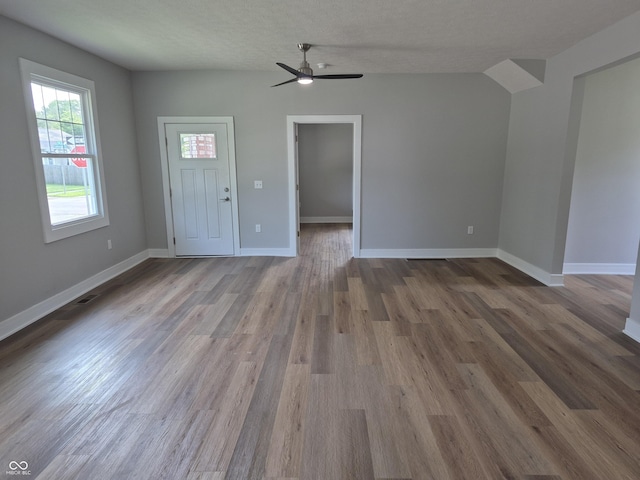 1501 California St, Columbus, IN 47201 - unfurnished living room featuring wood finished floors and ceiling fan