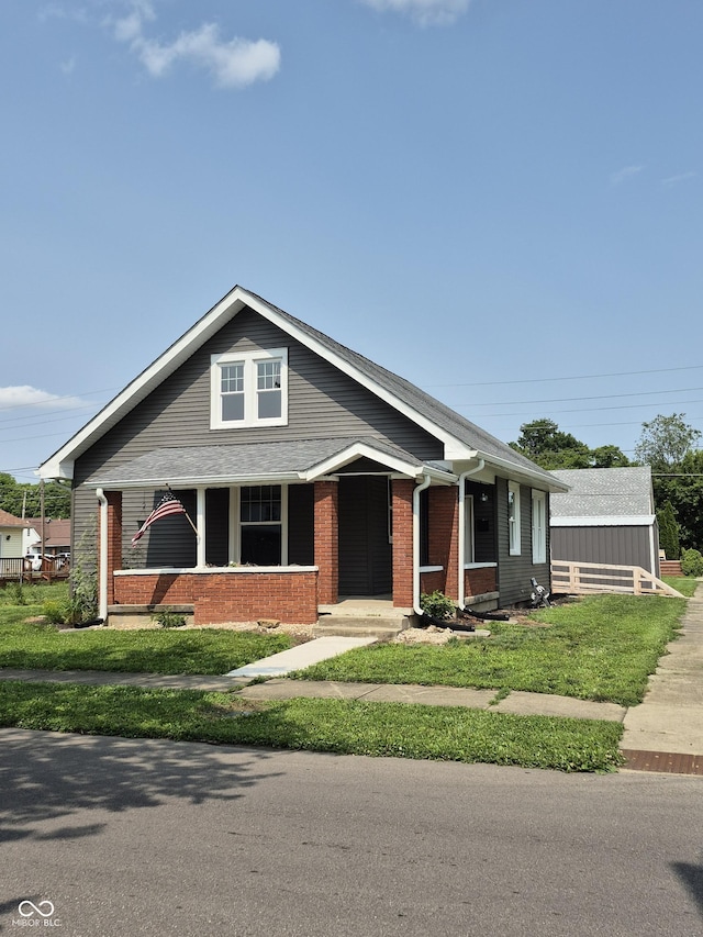 1501 California St, Columbus, IN 47201 - view of front of house featuring brick siding and a front yard