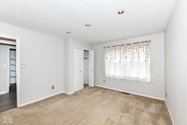 1124 Paradise Ct Unit B, Greenwood, IN 46143 - unfurnished bedroom with light carpet, a closet, and recessed lighting