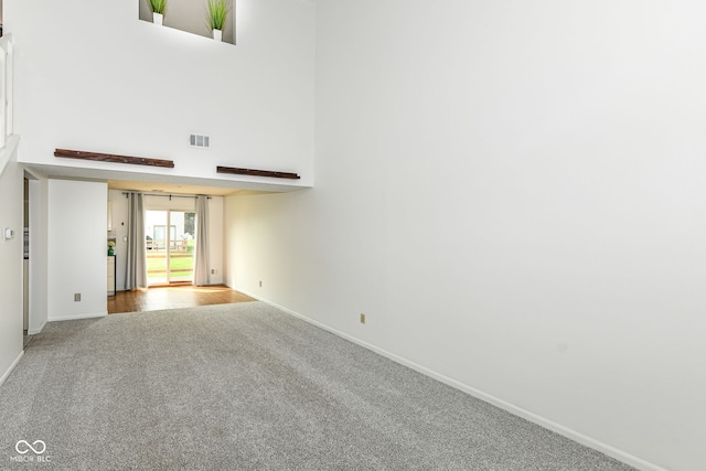 1124 Paradise Ct Unit B, Greenwood, IN 46143 - carpeted empty room with baseboards and a high ceiling