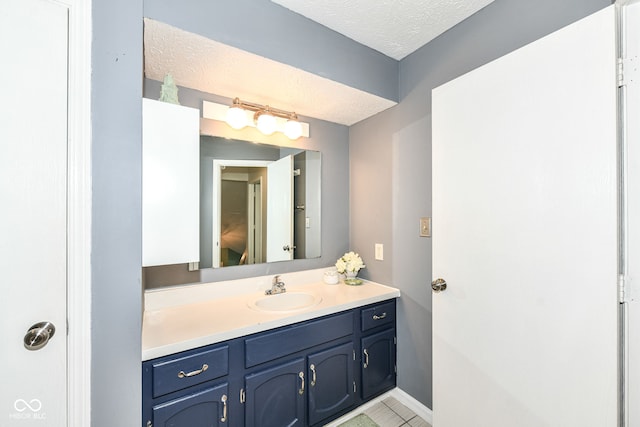 1124 Paradise Ct Unit B, Greenwood, IN 46143 - bathroom with vanity, a textured ceiling, and tile patterned floors