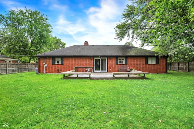 11630 Deanna Dr, Indianapolis, IN 46229 - back of property featuring a fenced backyard, a chimney, brick siding, and a patio