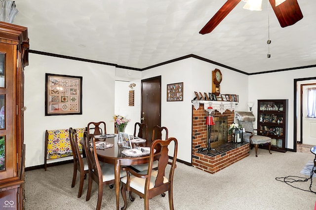 11630 Deanna Dr, Indianapolis, IN 46229 - carpeted dining area featuring a fireplace, ceiling fan, and ornamental molding