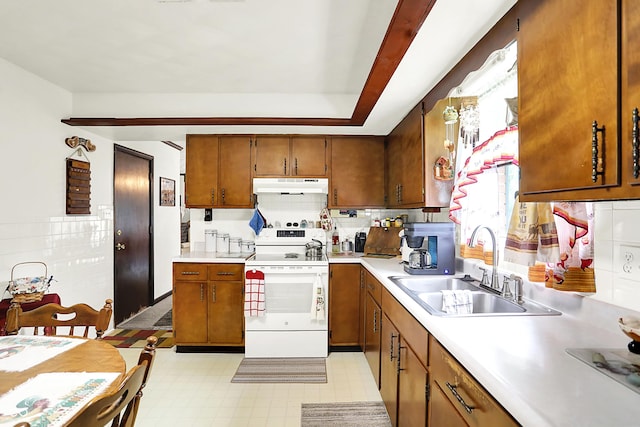 11630 Deanna Dr, Indianapolis, IN 46229 - kitchen featuring white range with electric stovetop, under cabinet range hood, brown cabinetry, light countertops, and light floors