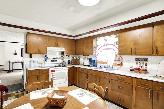 11630 Deanna Dr, Indianapolis, IN 46229 - kitchen featuring electric range, under cabinet range hood, backsplash, and light countertops