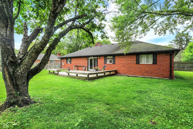 11630 Deanna Dr, Indianapolis, IN 46229 - back of house with brick siding, a chimney, and a wooden deck