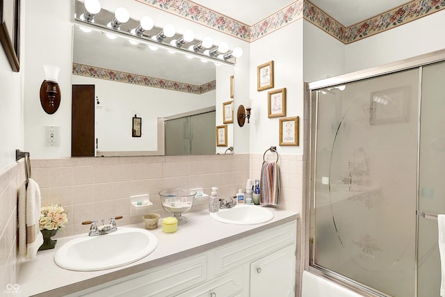 11630 Deanna Dr, Indianapolis, IN 46229 - bathroom with double vanity, enclosed tub / shower combo, and tasteful backsplash