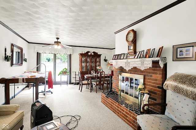 11630 Deanna Dr, Indianapolis, IN 46229 - living room featuring a fireplace, crown molding, a ceiling fan, and carpet floors