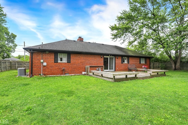 11630 Deanna Dr, Indianapolis, IN 46229 - rear view of property with a fenced backyard, brick siding, a chimney, and a deck