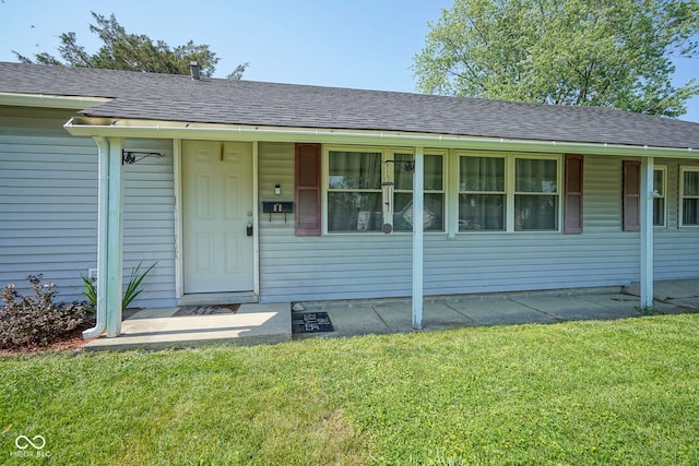11 Sayre Dr, Greenwood, IN 46143 - view of front of home featuring a front yard and a shingled roof