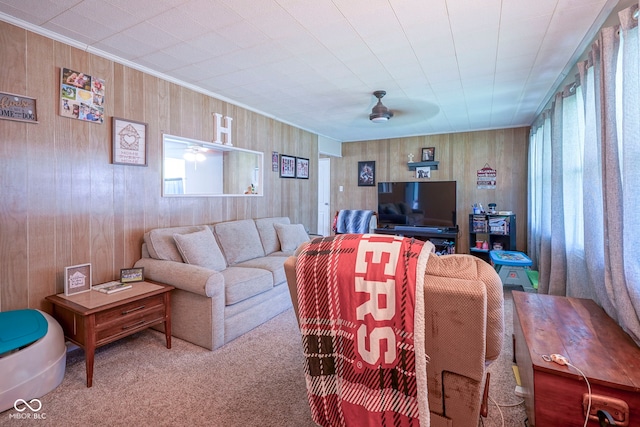 11 Sayre Dr, Greenwood, IN 46143 - carpeted living area featuring a ceiling fan, healthy amount of natural light, wooden walls, and crown molding