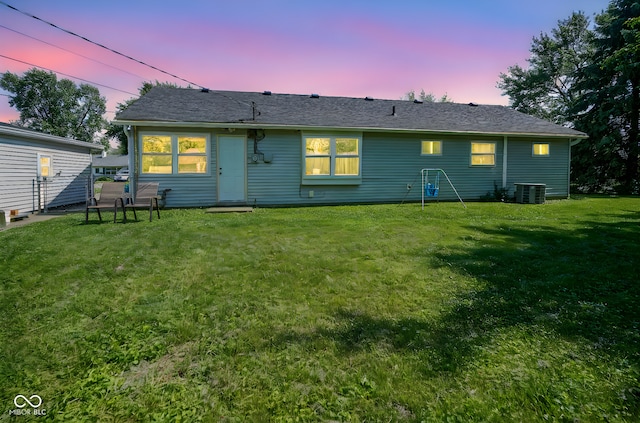 11 Sayre Dr, Greenwood, IN 46143 - back of house at dusk featuring a lawn