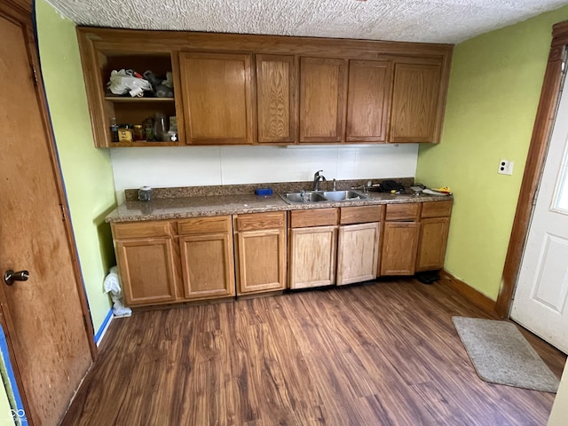 1163 Groff Ave, Indianapolis, IN 46222 - kitchen with dark wood-style floors, brown cabinets, dark countertops, open shelves, and a textured ceiling