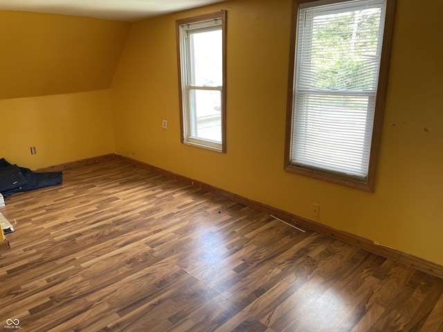 1163 Groff Ave, Indianapolis, IN 46222 - additional living space featuring wood finished floors, vaulted ceiling, and healthy amount of natural light