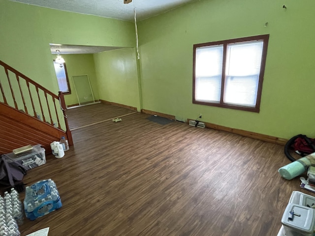 1163 Groff Ave, Indianapolis, IN 46222 - unfurnished living room with wood finished floors and stairway