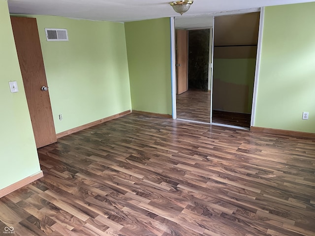 1163 Groff Ave, Indianapolis, IN 46222 - unfurnished bedroom featuring dark wood-type flooring and a closet