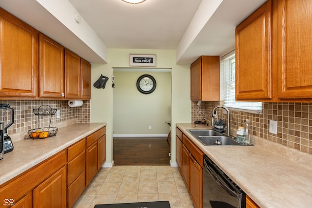 2170 N Old State Road 9, Columbus, IN 47203 - kitchen with black dishwasher, brown cabinetry, light countertops, and backsplash