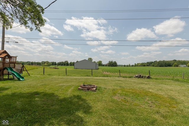 2170 N Old State Road 9, Columbus, IN 47203 - view of yard featuring a view of countryside, a playground, and an outdoor fire pit