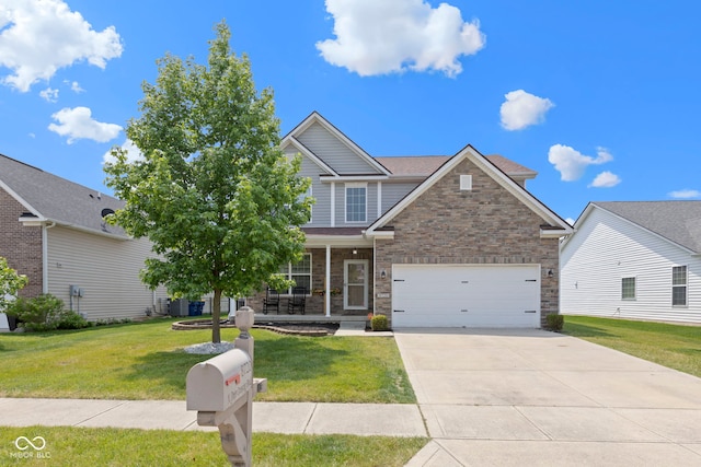 8720 N Deer Crossing Blvd, Mccordsville, IN 46055 - view of front of property featuring a porch, concrete driveway, a front yard, and stone siding