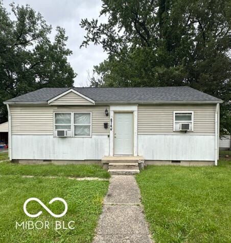 4744 E 33rd St, Indianapolis, IN 46218 - view of front of property with crawl space, a front lawn, and cooling unit