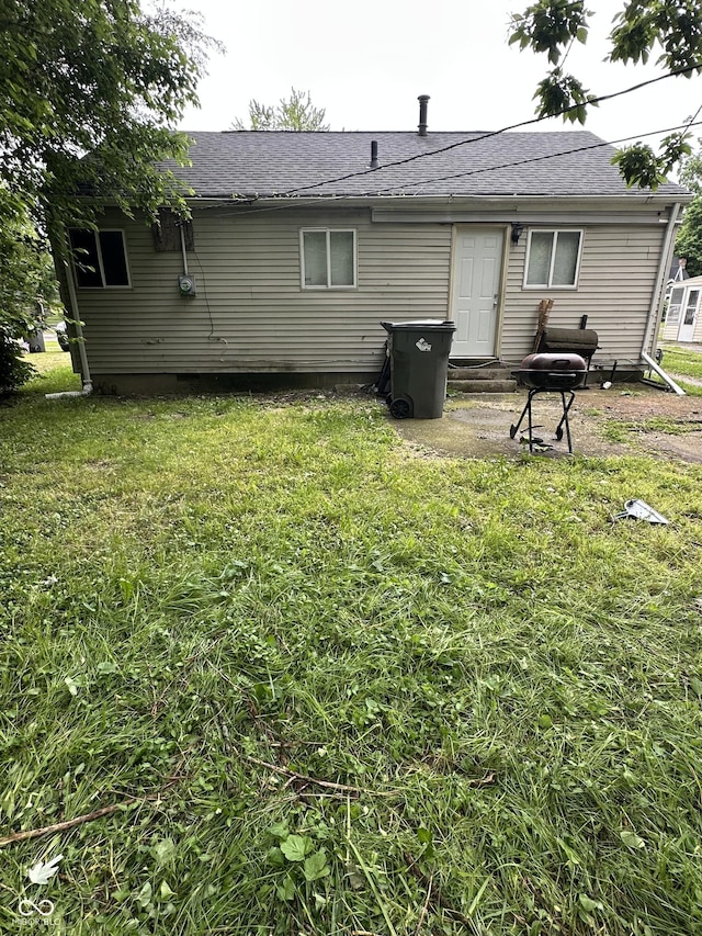 4744 E 33rd St, Indianapolis, IN 46218 - back of property featuring a lawn and a shingled roof