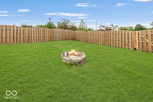 12845 Touchdown Dr, Fishers, IN 46037 - fenced backyard featuring a fire pit
