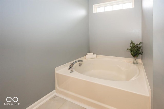 12845 Touchdown Dr, Fishers, IN 46037 - full bath featuring a garden tub and marble look tile flooring