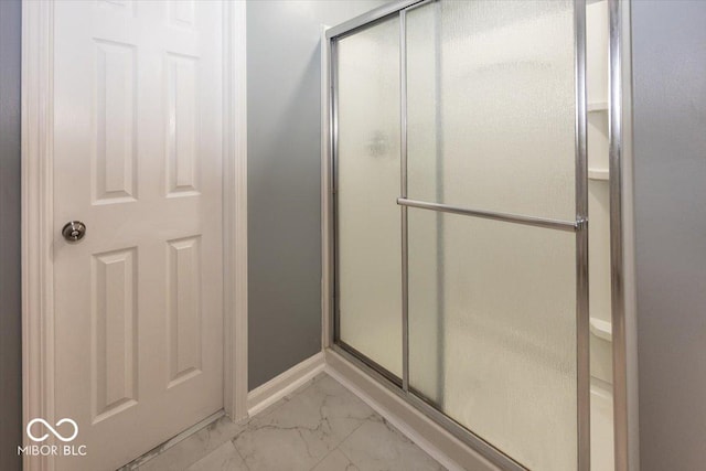 12845 Touchdown Dr, Fishers, IN 46037 - bathroom with a shower stall and marble look tiles
