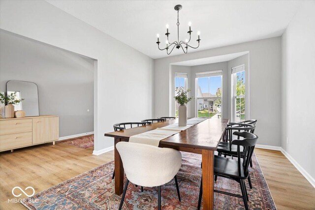 4253 Ironclad Dr, Bargersville, IN 46106 - dining room featuring a chandelier and light wood-type flooring