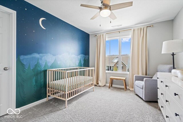 4253 Ironclad Dr, Bargersville, IN 46106 - carpeted bedroom with a nursery area and a ceiling fan