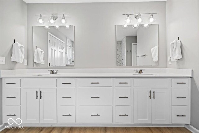 4253 Ironclad Dr, Bargersville, IN 46106 - full bath featuring double vanity, a shower, and wood finished floors