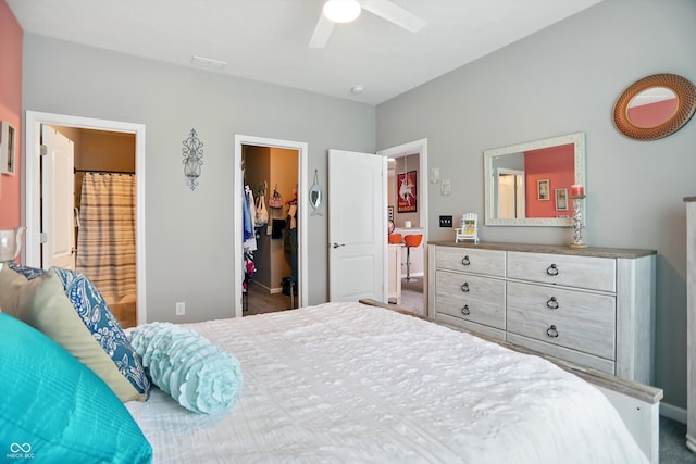 6315 Emerald Field Way, Indianapolis, IN 46221 - carpeted bedroom with a walk in closet, a closet, a ceiling fan, and ensuite bathroom